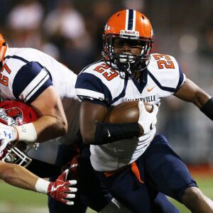 Naperville North’s Elijah Jordan (23) picks up yardage. Allen Cunningham/For the Sun-Times.