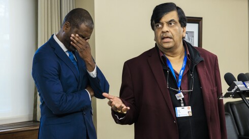 State Rep. La Shawn K. Ford holds his head as Resilience Healthcare CEO Manoj Prasad explains West Suburban Medical Center's finances Wednesday.