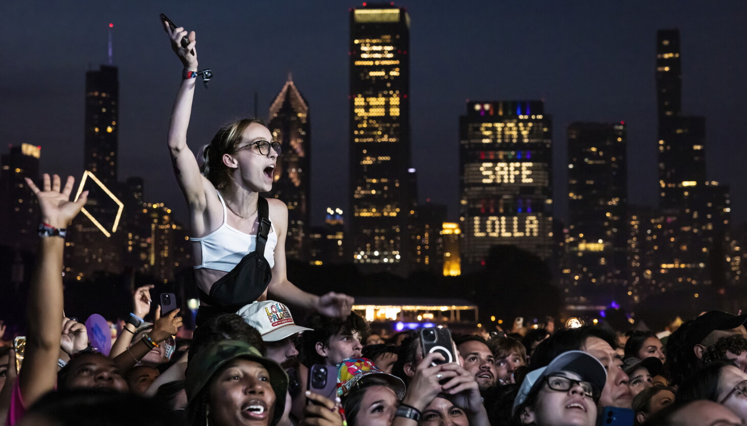 Crowd watching Lollapalooza screens