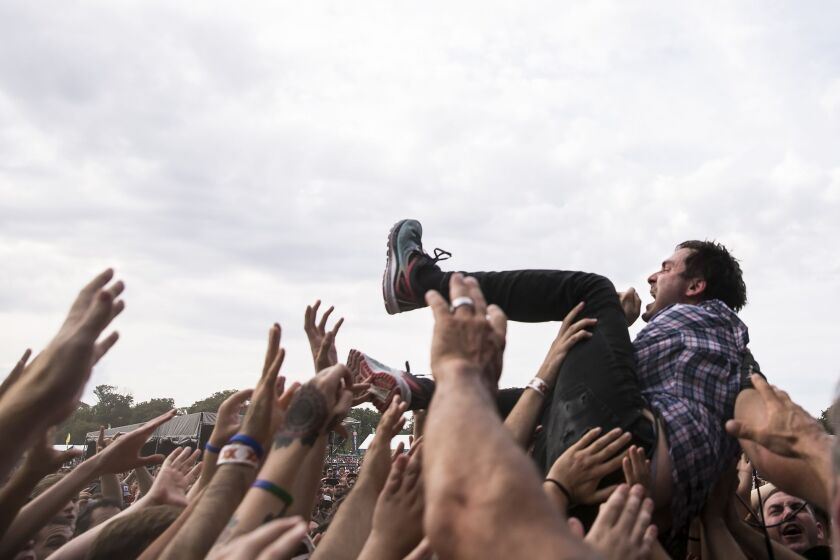 Tim Kinsella, of Cap’n Jazz, crowd surfs during his performance on day three of Riot Fest in Douglas Park, Sept. 16, 2017. | Ashlee Rezin/Sun-Times