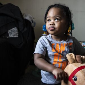 Kayden Swann, 2, plays in his family’s South Chicago neighborhood apartment Tuesday morning on the South Side. Kaden is blind in his right eye after he was shot in the head on April 6, 2021, during a road rage incident on DuSable Lake Shore Drive near Grant Park.