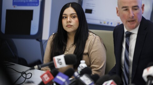 Marimar Martinez listens to her attorneys speak during a press conference on Wednesday in the Loop to announce a civil lawsuit and the release of evidence related to Martinez's shooting by a federal agent in Brighton Park in October.