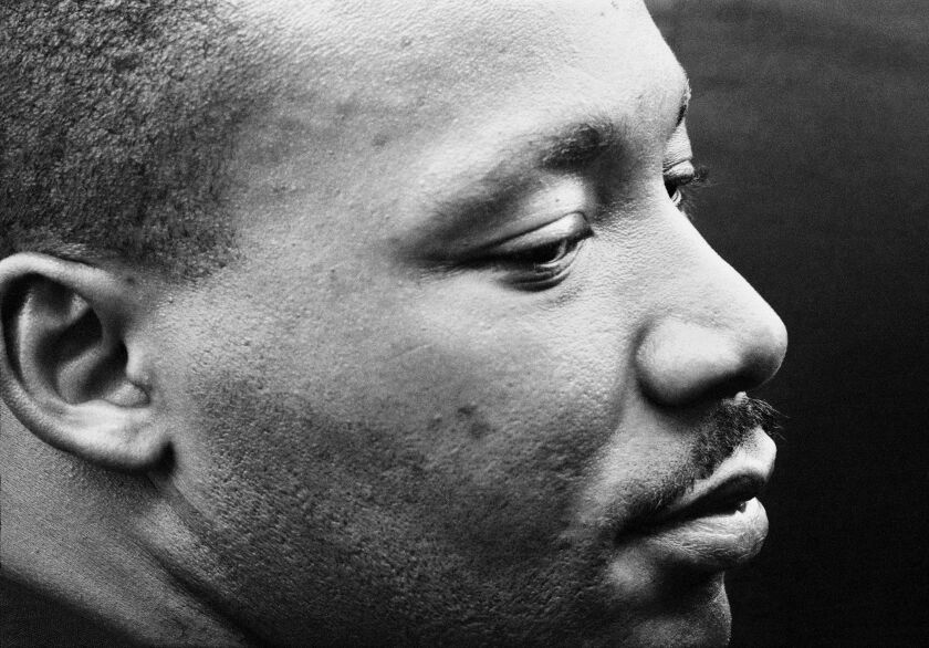 Martin Luther King, Jr. is deep in meditation after delivering his “I Have a Dream” speech at the March on Washington in 1963. The photo was taken by Dan Budnik.