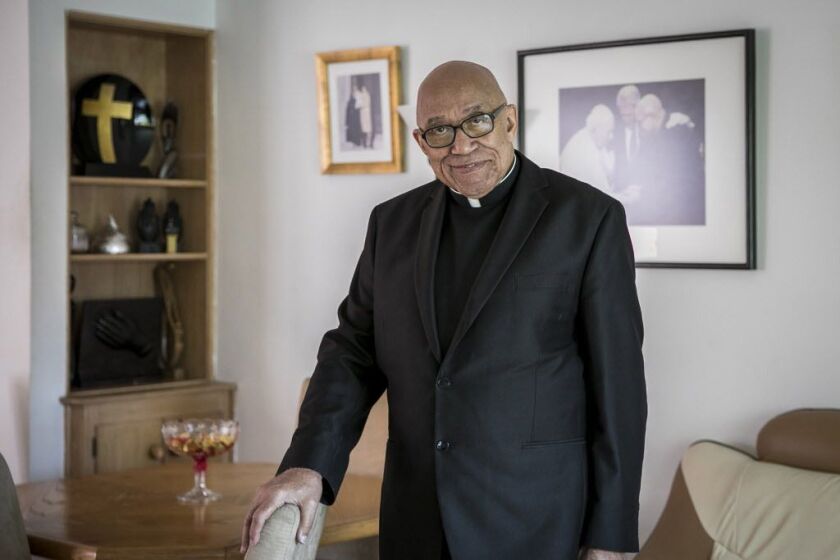 Father George Clements, 85, at his Evergreen Park home in 2017.