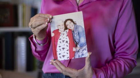 Eileen Kerlin Walsh holds a photo of her mother Mary Kerlin.