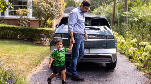 EJ Fagan takes his 2-year-old son Cinco to school in west suburban Riverside on Sept. 15.