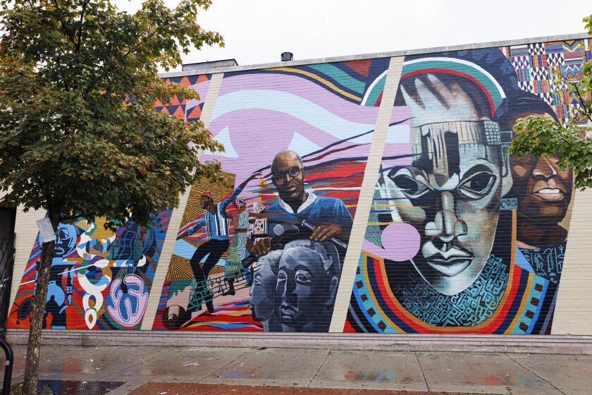 A fuller view of the Mitchell Caton and Calvin Jones mural that was recently restored.