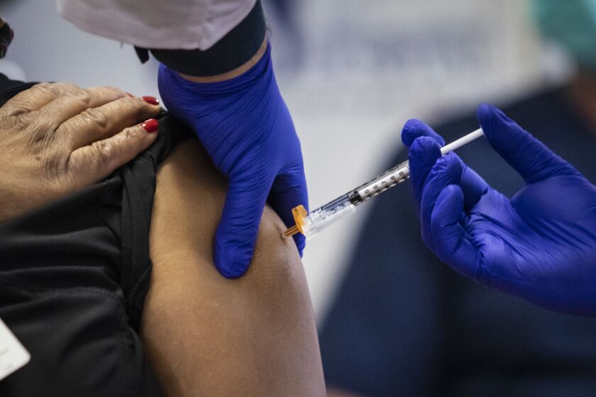A dose of the Pfizer-BioNTech COVID-19 vaccine is administered at Norwegian American Hospital in January.