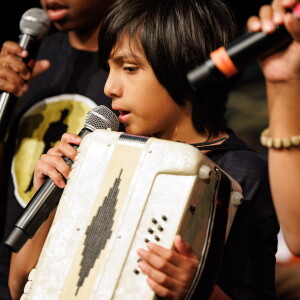 Luis holds an accordion and sings during Fernando Jones' 17th annual Blues Camp International at the Music Center of Columbia's School of Audio and Music.