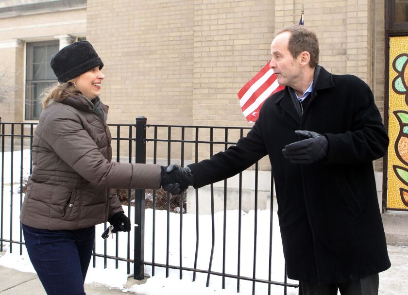 Megan Mortensen greets Ald. Tom Tunney outside Agassiz Elementary School Tuesday Feb. 24, 2015. | Kevin Tanaka/For Sun-Times Media