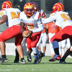 North Lawndale’s Marquise Earskines (3) fakes a hand-off. Worsom Robinson/For the Sun-Times.