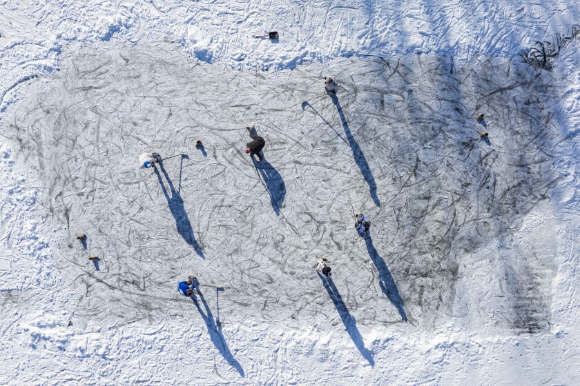 Pond hockey players have a pick-up game at North Pound outside the Peggy Notebaert Nature Museum on Monday.
