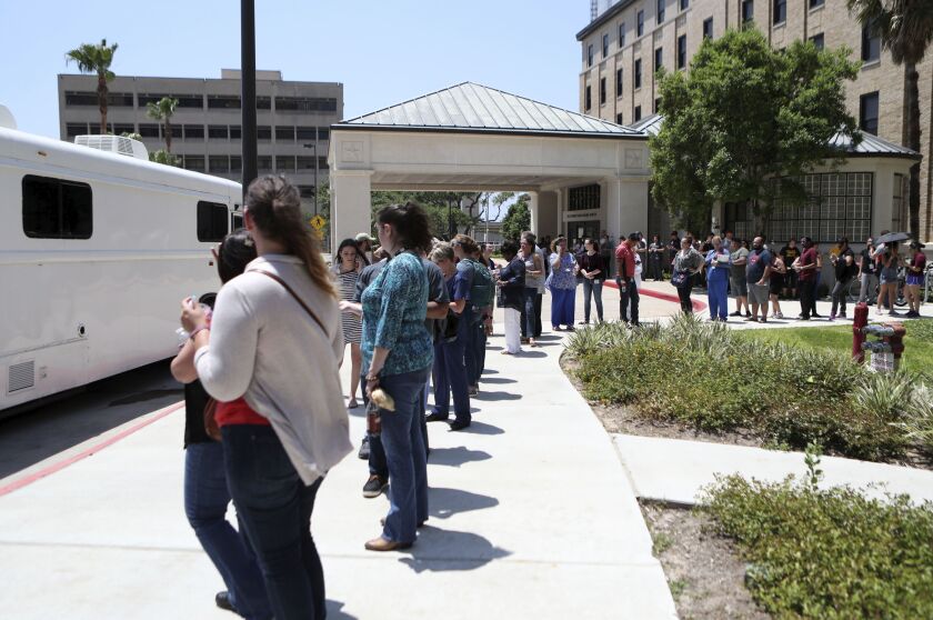 People wait to give blood after news of the shooting at Santa Fe High School at Jennie Sealy Hospital at the University of Texas Medical Branch in Galveston, Texas on Friday, May 18, 2018. MD Anderson Cancer Center brought a van from their Blood Donor Cen
