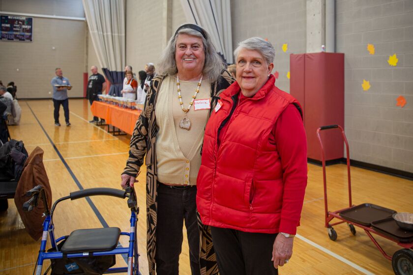 Stefanie Clark (left) with her roommate and best friend, Jane Callahan-Moore, during a Thanksgiving lunch at Center on Halsted on Thursday.