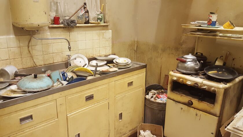 The Rolling Stones’ first London flat, including the kitchen sink that Mick Jagger jokingly said contains “too many dirty dishes,” has been recreated for “Exhibitionism.” | MIRIAM DI NUNZIO PHOTO