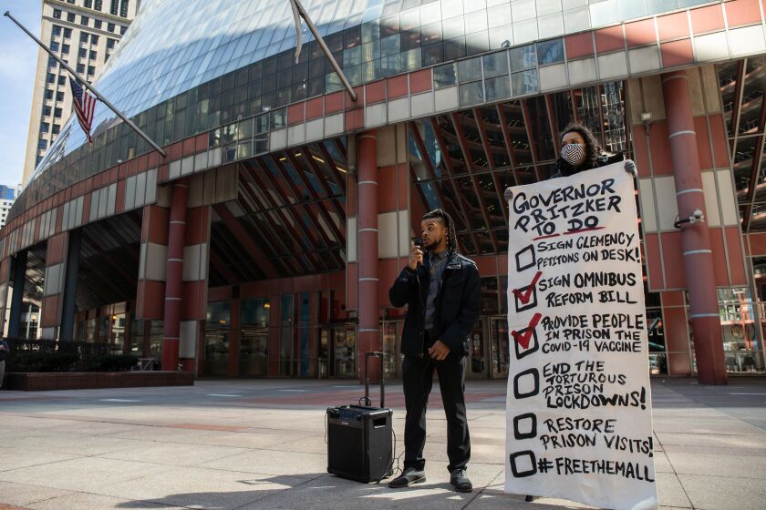 Malik Alim, a campaign coordinator at for the Coalition to End Money Bond, speaks outside the James R. Thompson Center in the Loop, Friday morning, March 9, 2021.