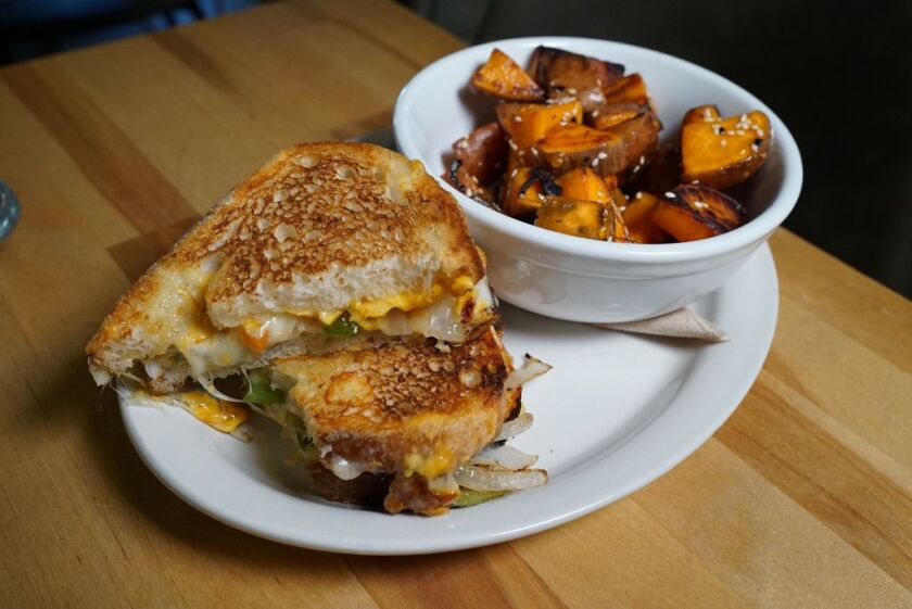 The grilled cheese sandwich and sweet potatoes served at Smack Dab restaurant. 