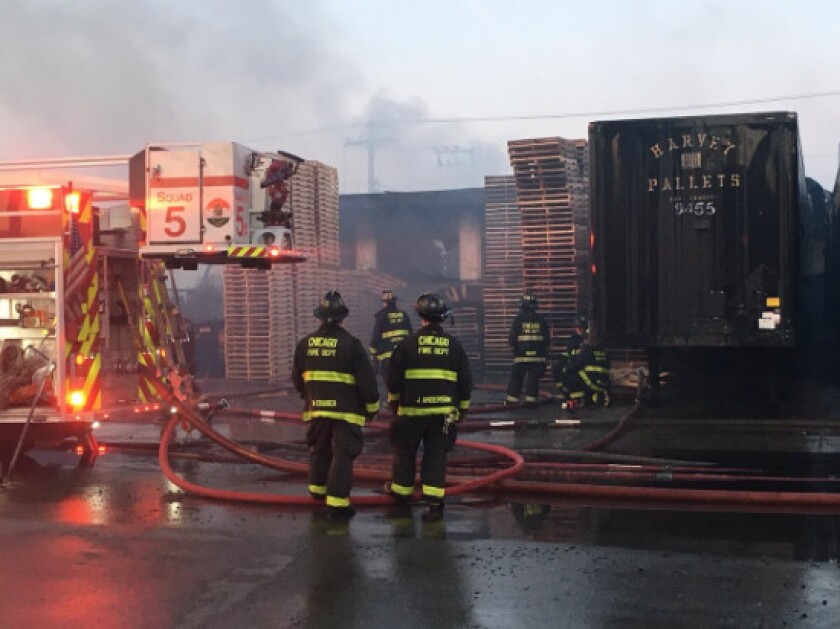 Fire crews battle an extra-alarm blaze Monday night at a pallet factory in the Canaryville neighborhood. | Chicago Fire Media Affairs