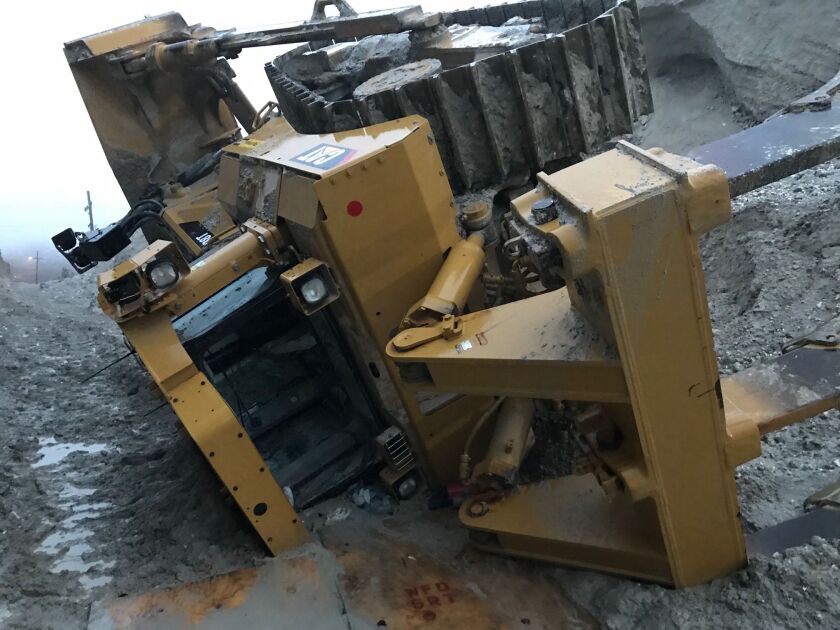 A man became trapped in a bulldozer early Monday at a gypsum quarry in north suburban Waukegan. | Waukegan Fire Department