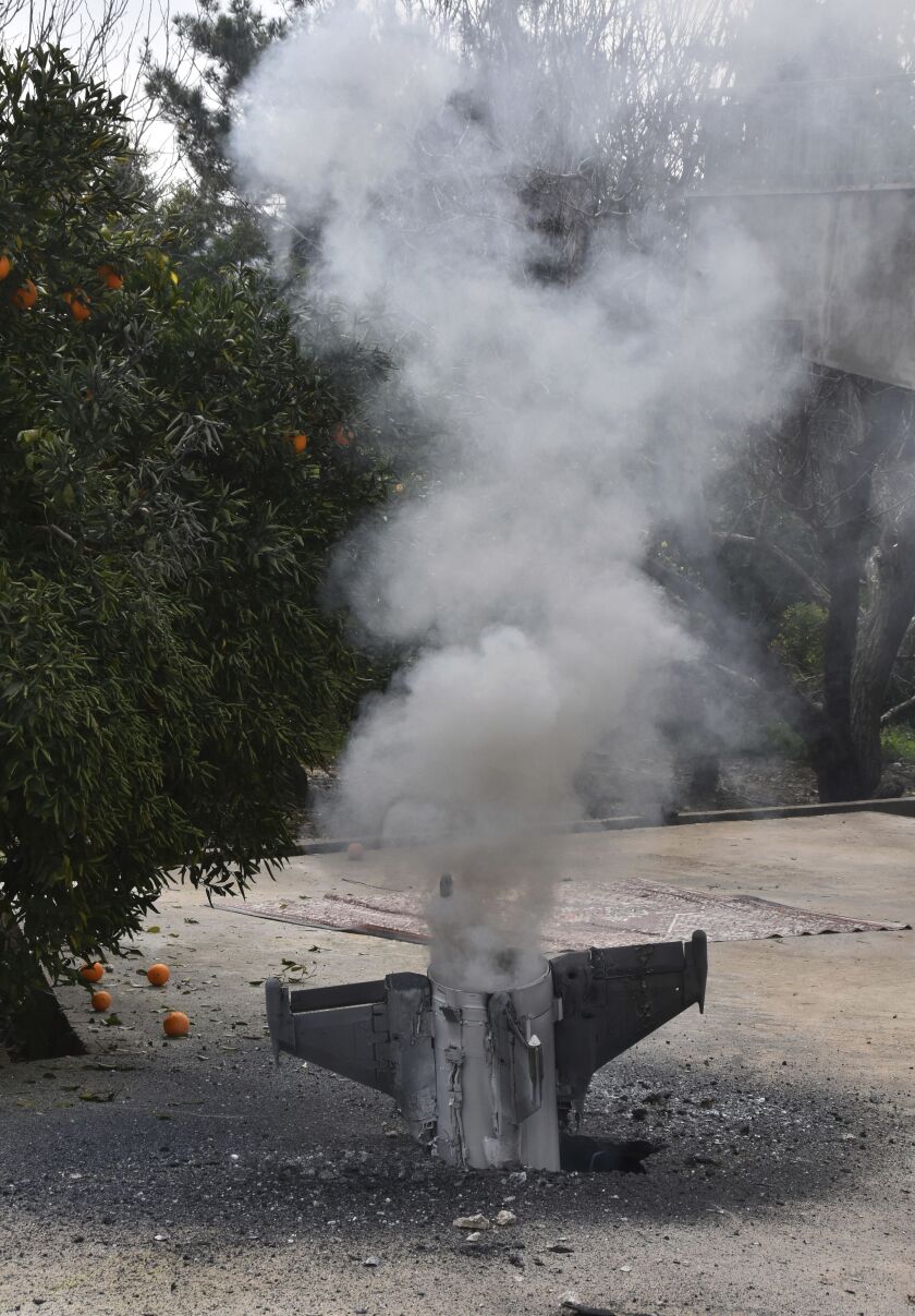 Smoke rises from a missile, which according to the Lebanon national news agency appears to be part of a Syrian air defense missile targeting an Israeli warplane, the missile part landed in Hasbani village, southwest Lebanon, on Saturday. | AP photo