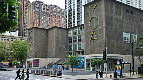 Pedestrians walk near the entrance and facade of the Museum of Contemporary Art in Chicago on September 9, 2026.