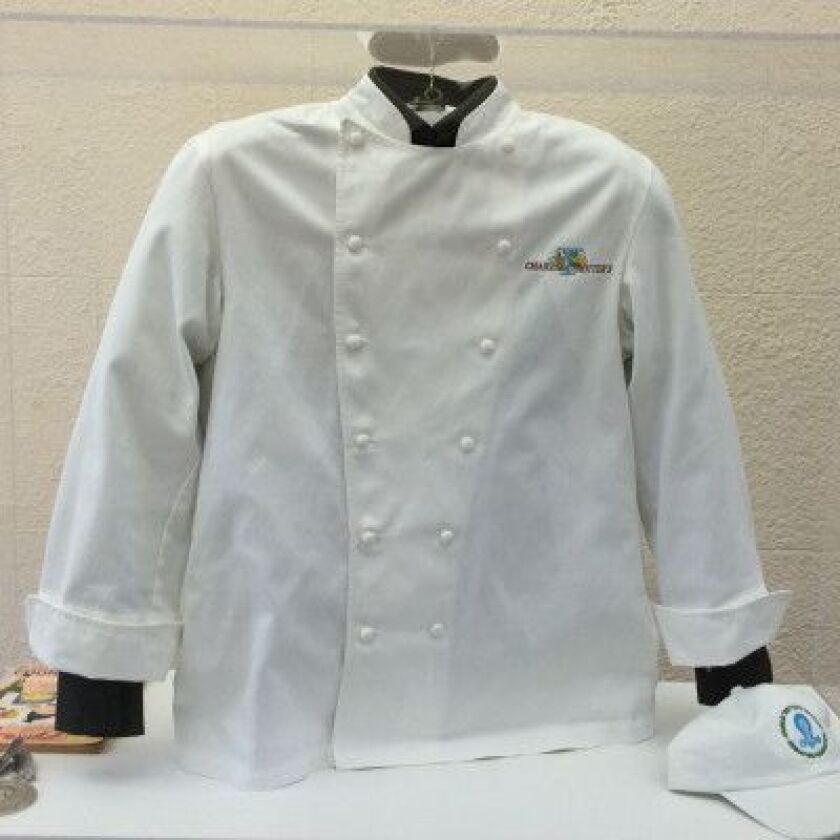 Charlie Trotter’s chef’s coat. From the exhibit “Charlie Trotter: Chef, Artist, Thinker” at the City Gallery in the Historic Water Tower. | PHOTO BY MIRIAM DI NUNZIO /FOR THE SUN-TIMES