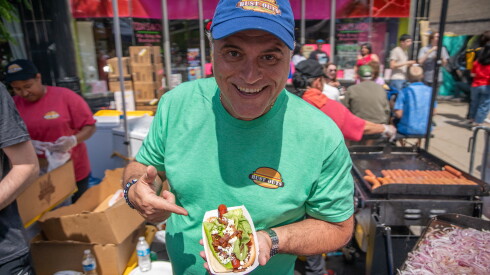 Bust Outs owner Angelo Palivos shows off his signature Blue Dog at the Windy City Hot Dog Fest.