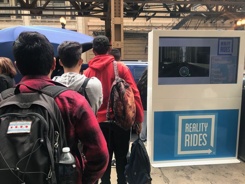 The driving simulator drew a crowd outside Harold Washington College. | Taylor Hartz/For the Sun-Times