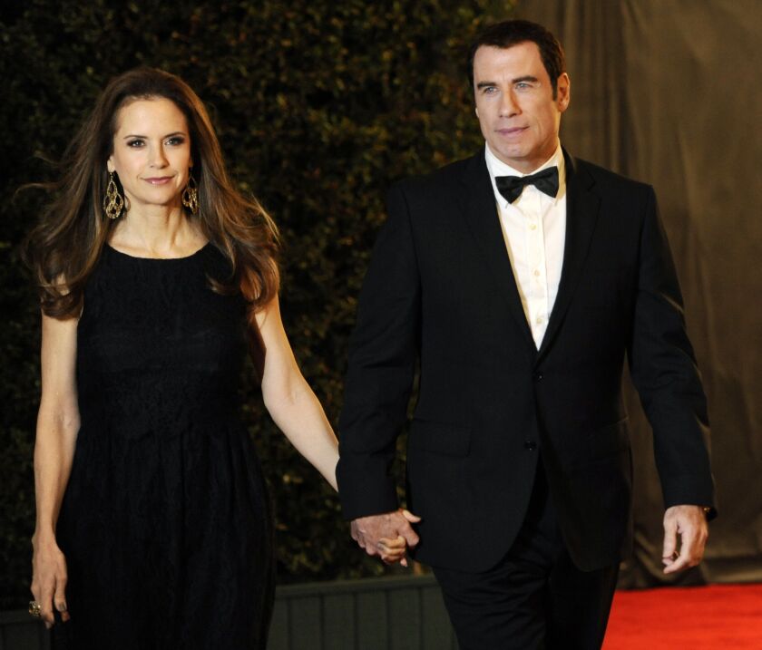 Actress Kelly Preston her husband John Travolta arrive at the Academy of Motion Picture Arts and Sciences’ 2011 Governors Awards in Los Angeles.