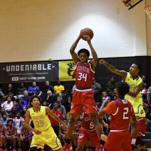 Curie’s Jermel Grigsby (34) hauls in a rebound. Worsom Robinson/For the Sun-Times.