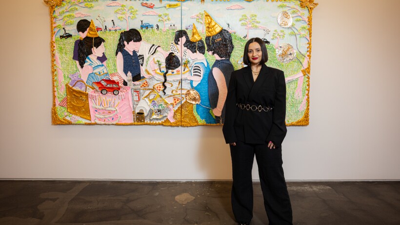 Yvette Mayorga in front of her piece “She’s in the cake/Put out the fire after Nicolas Lancret” at Monique Meloche gallery.