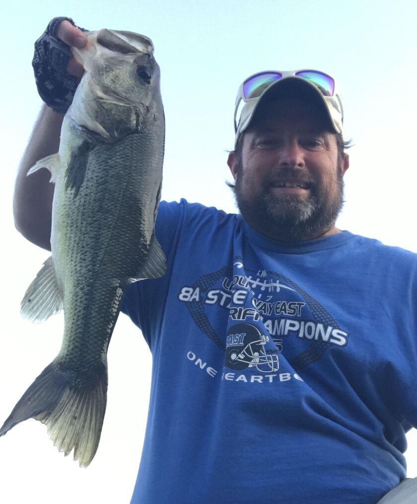 Ken “Husker” O’Malley and a local largemouth bass. Provided photo