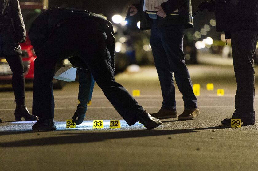 Chicago police investigate a scene where three people where wounded in a shooting Friday night in the 3400 block of West Ohio Street. | Tyler LaRiviere/Sun-Times