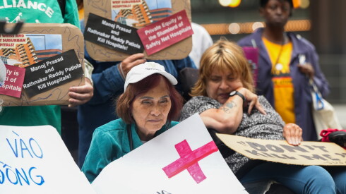 Dozens of protesters gather at Daley Plaza to demand the re-opening of the West Suburban Medical Center and Weiss Memorial Hospital, Tuesday, July 28, 2026.