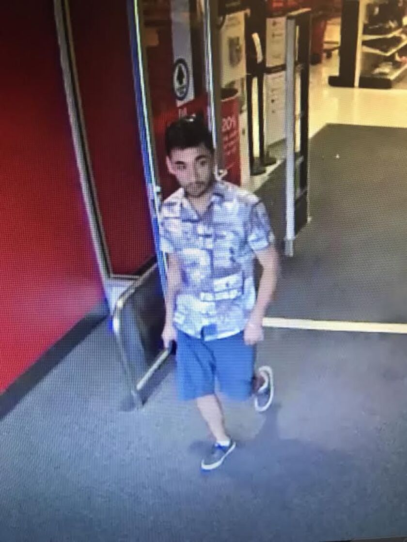 Surveillance photo of person wanted for using a stolen credit card in Downers Grove, suspected of stealing purse in Lemont | Palos Park police