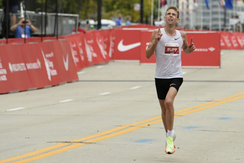 Galen Rupp, of the United States, finishes in second place in the men’s Chicago Marathon, Sunday, Oct. 10, 2021, in Chicago.