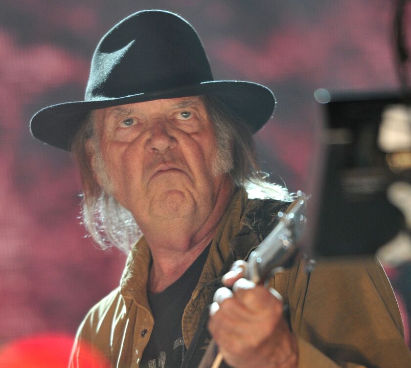 Neil Young performs at Farm Aid 30 at FirstMerit Bank Pavilion at Northerly Island on Saturday. | Rob Grabowski/Invision/AP