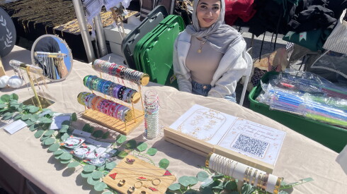 Ablah Maali, 19, at her booth at Palestine Fest, held outside Seat Geek Stadium in Bridgeview on Sunday, Oct. 4, 2026.