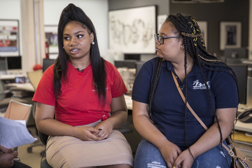 Arieyanna Williams, 18, left, of North Lawndale and Rie’Onna Holmon, 15, of Woodlawn. Arieyanna went to Florida to visit students at Marjory Stoneman Douglas High School shortly after the February massacre. | Rich Hein/Sun-Times