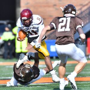 Montini’s Deontay Bell (11) gets tripped up. Worsom Robinson/For the Sun-Times.