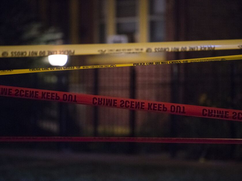 Police investigate the scene where a man was shot and killed Monday night in the 5700 block of South Winchester. | Tyler LaRiviere/Sun-Times