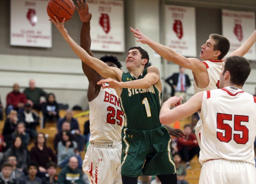 Stevenson’s John Ittounas (1) drives past the Benet defense to score.