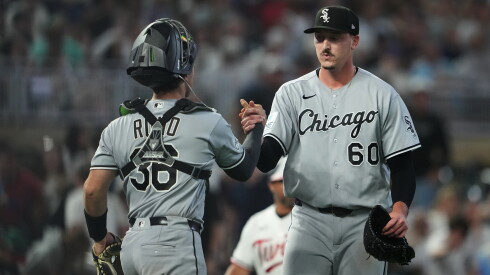 Chicago White Sox catcher Drew Romo and pitcher Bryan Hudson react after winning against the Minnesota Twins on Friday.