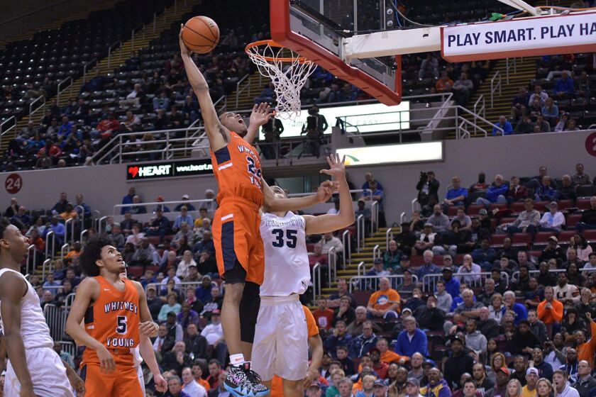 Young’s Tyler Beard (24) attempts a dunk against Evanston Friday 03-16-18. Worsom Robinson/For the Sun-Times.