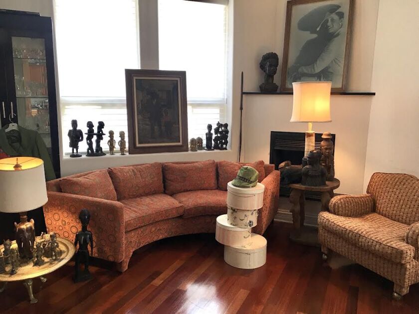 All of the furniture and art in the family’s great room, anchored by a curved Dunbar couch, are available in the Claude Barnett and Etta Moten Barnett estate sale being handled by Estate Sale Goddess.