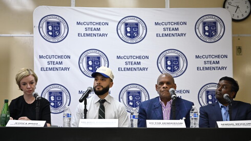 Chicago Board of Education presidential candidates (from left) Jessica Biggs, Hilario Dominguez, Victor Henderson, and Sendhil Revuluri listen during their first debate together at the McCutcheon STEAM Elementary School branch building on Thursday, Sept. 3, 2026.