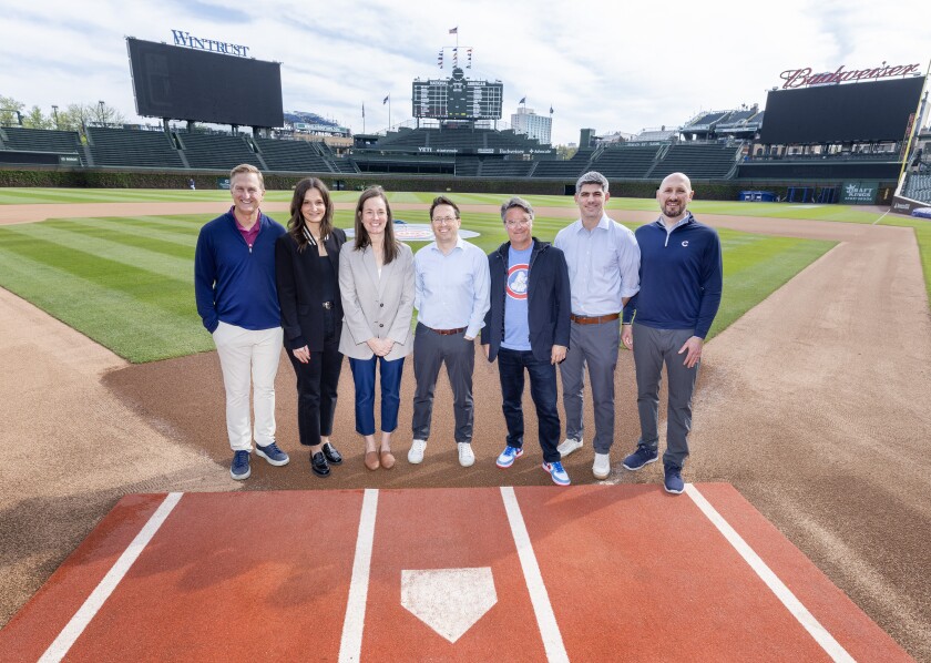 President of Business Operation Crane Kenney, Director of Events Megan Gaseor, Senior Director of Operations and Guest Experience Morgan Bucciferro, Chief Commercial Officer Colin Faulkner, Vice President Wrigley Field Events Andy Blackburn, Senior Vice President Marquee 360 Cale Vennum, Director and Chief Operations Officer David Cromwell pose at home plate looking back on 20 years of concerts and how the shows are booked and staged at Wrigley Field.