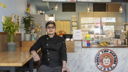 Vincent Yang sits in the main lobby of Monkey King Jianbing, his Chinese restaurant located at 3411 Dempster St. in Skokie.