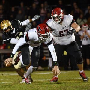 Yorkville’s Josh Beetham (8) trips. Worsom Robinson/For the Sun-Times.