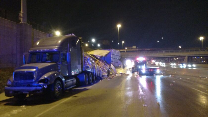 Inbound lanes of the Dan Ryan Expressway were closed to traffic Thursday night after a semi truck crashed and spilled its load of Coffeemate on the South Side. | Chicago Fire Department